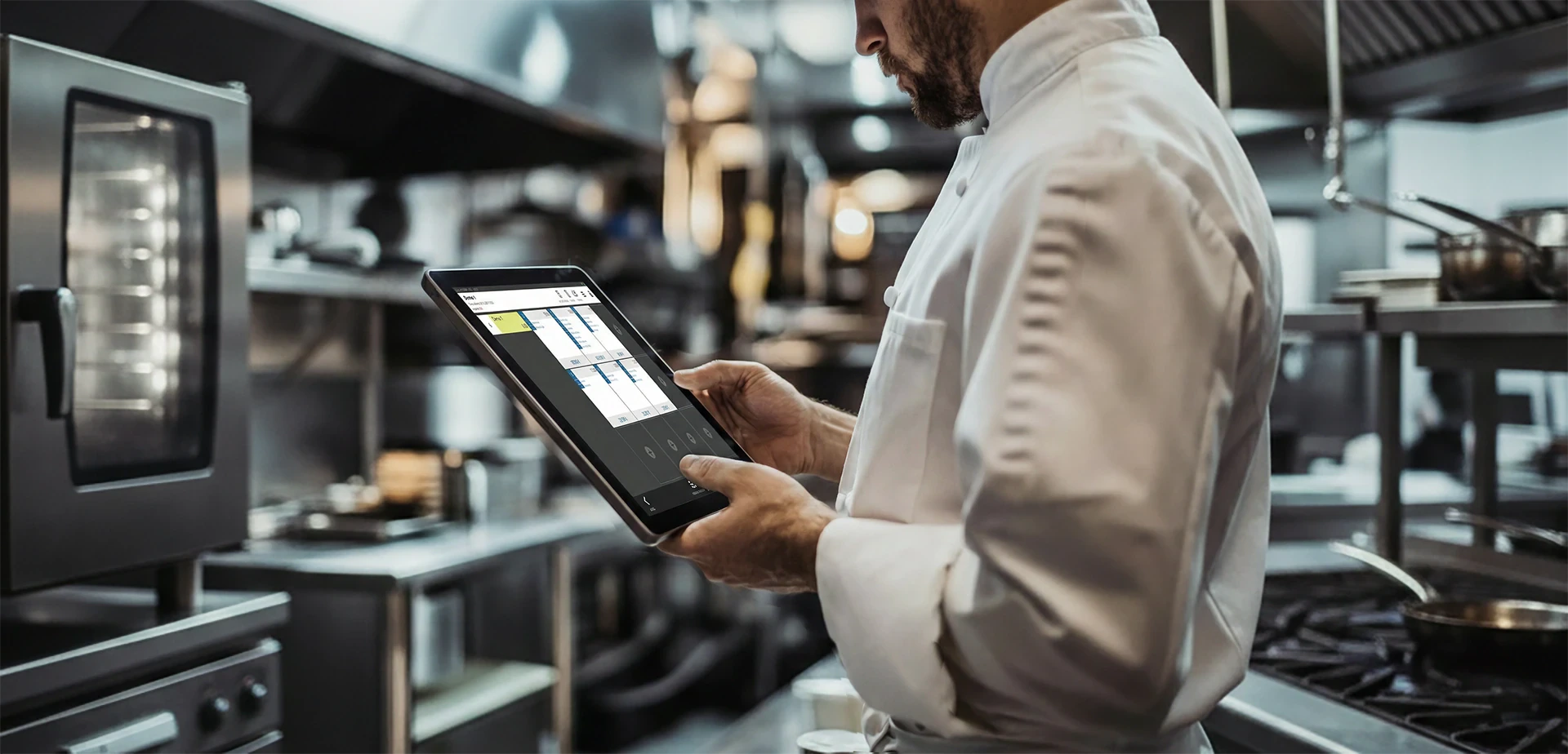 Chef using a digital system to manage back-of-house restaurant operations